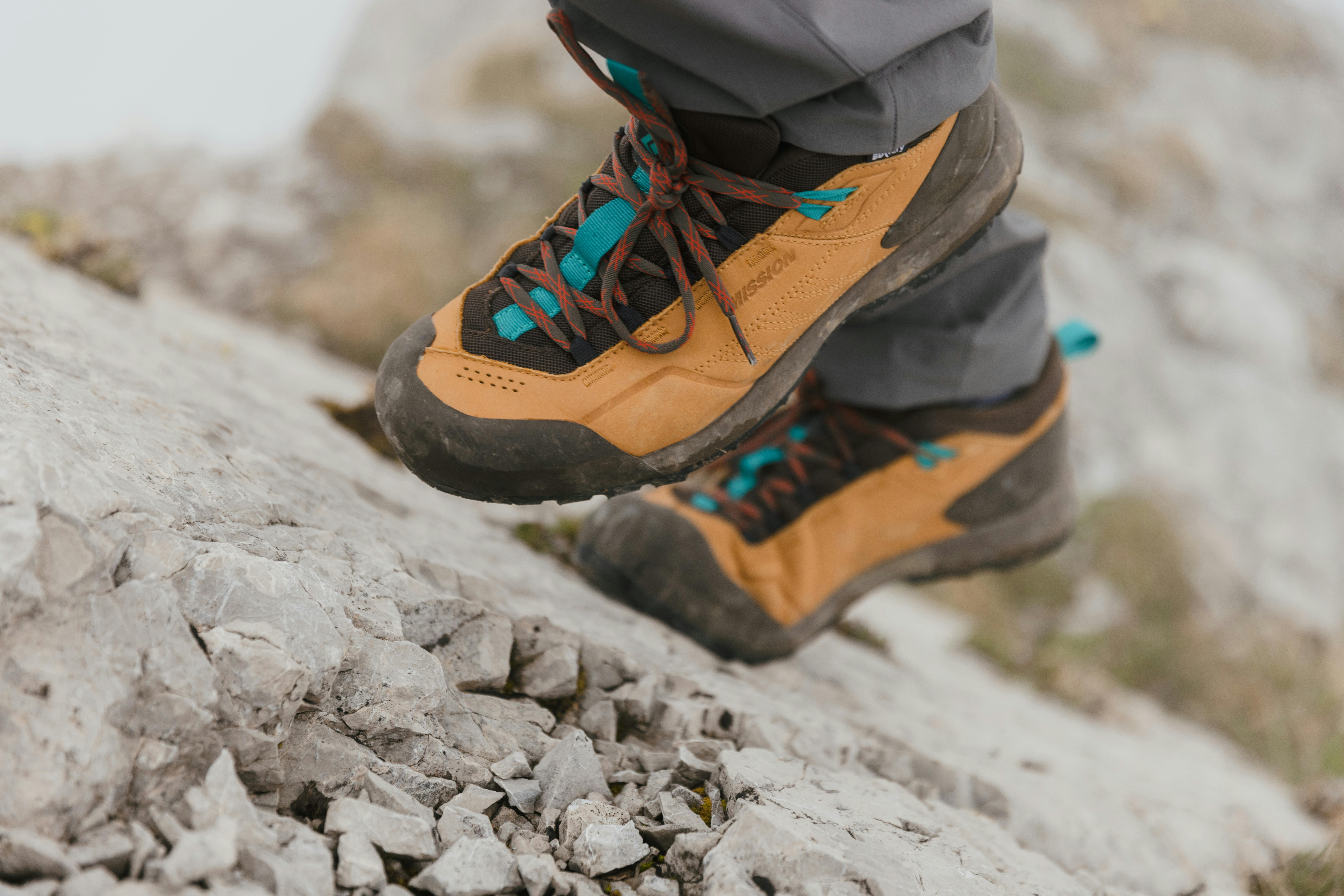 A hiker steps up steep rock in Mission Leather Approach WP Shoes.