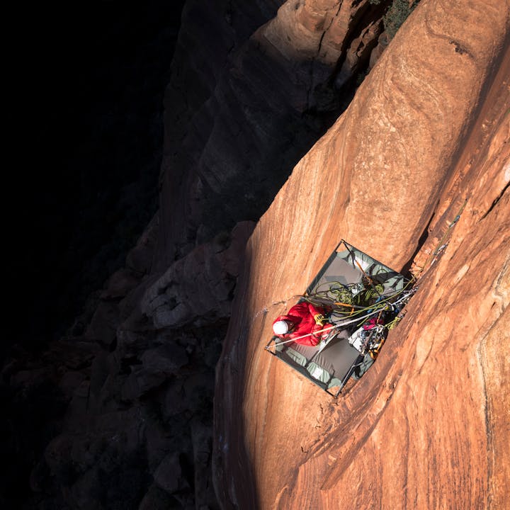 climber resting on a portaledge | Big Wall Climbing gear