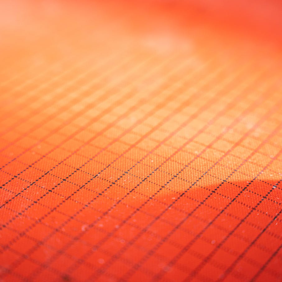 100% recycled polyester shell fabric with ripstop grid