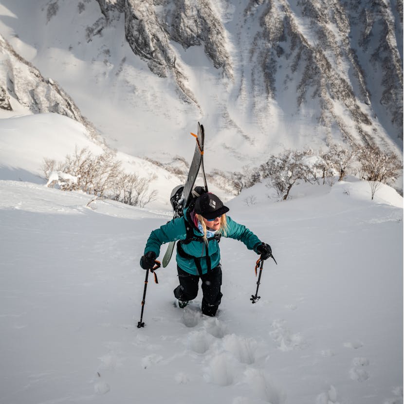 Black Diamond athlete Mary McIntyre boot packs up a mountain.
