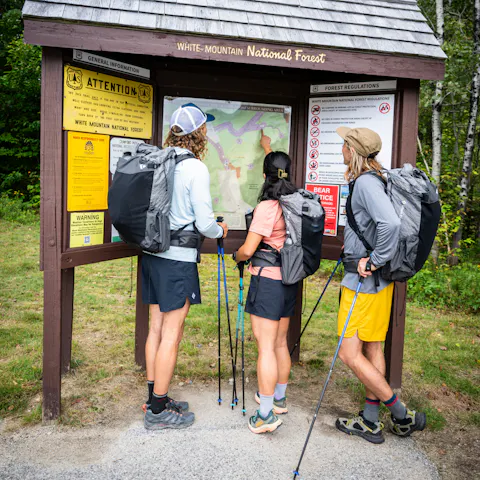 Three Hikers using the Black Diamond fastpacking kit. 