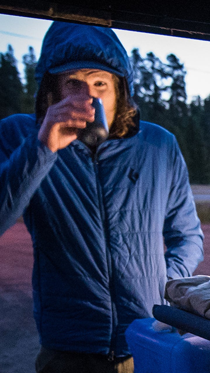 Joe Grant drinking coffee before the beginning of his run