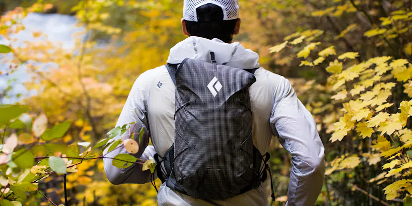 A black diamond back pack being used by a trail runner