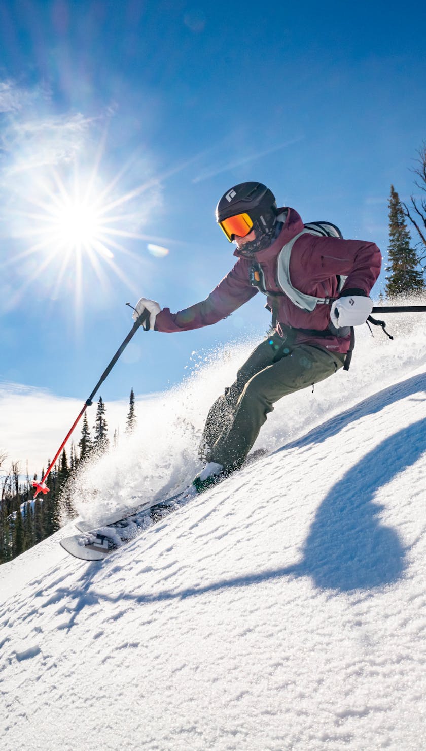 Spring Ski Sale ID. A backcountry skier enjoys spring skiing conditions. 