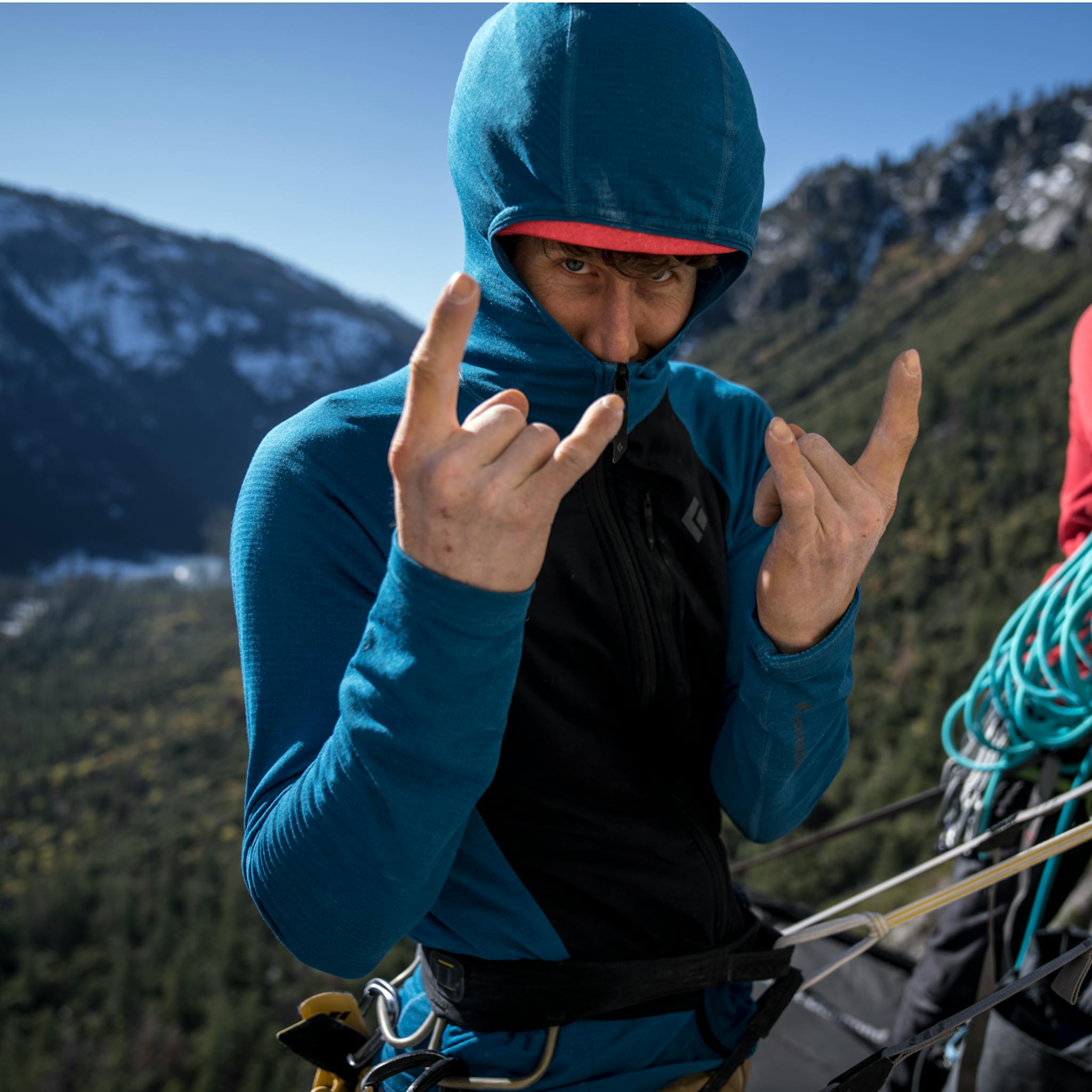 A climber wearing Black Diamond Coefficient LT hybrid hoody is stoked for the climb.