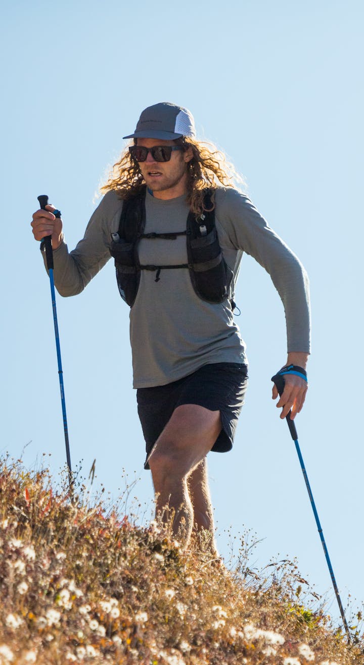 BD Athlete Joe Grant running up a hillside