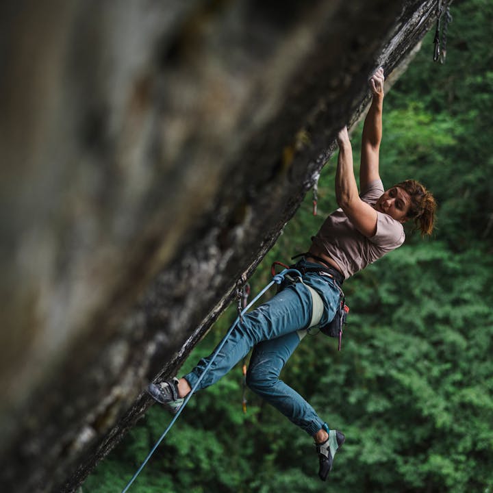 BD athlete Colette McInerney climbs in a Solution Harness. 