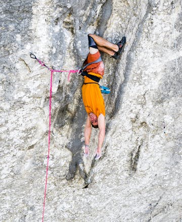 Black Diamond athlete Seb Bouin hangs out with a no hands kneebar rest. 