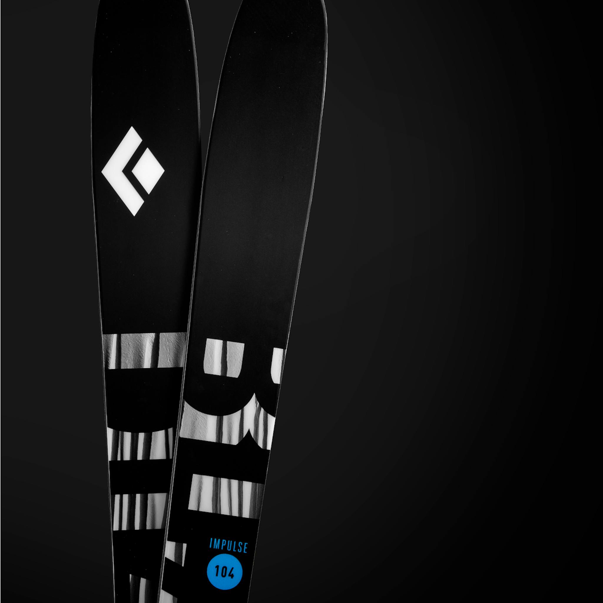 Two crisscrossing Impulse 104 skis.