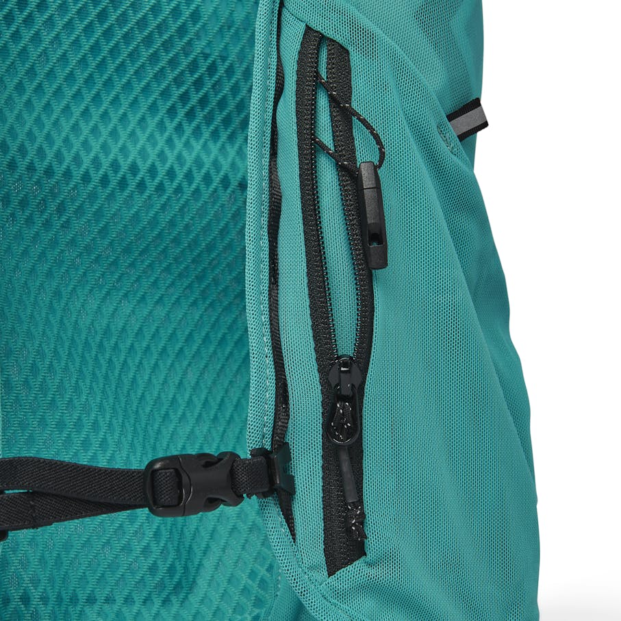 Front zip pocket with a key clip and removable micro race whistle