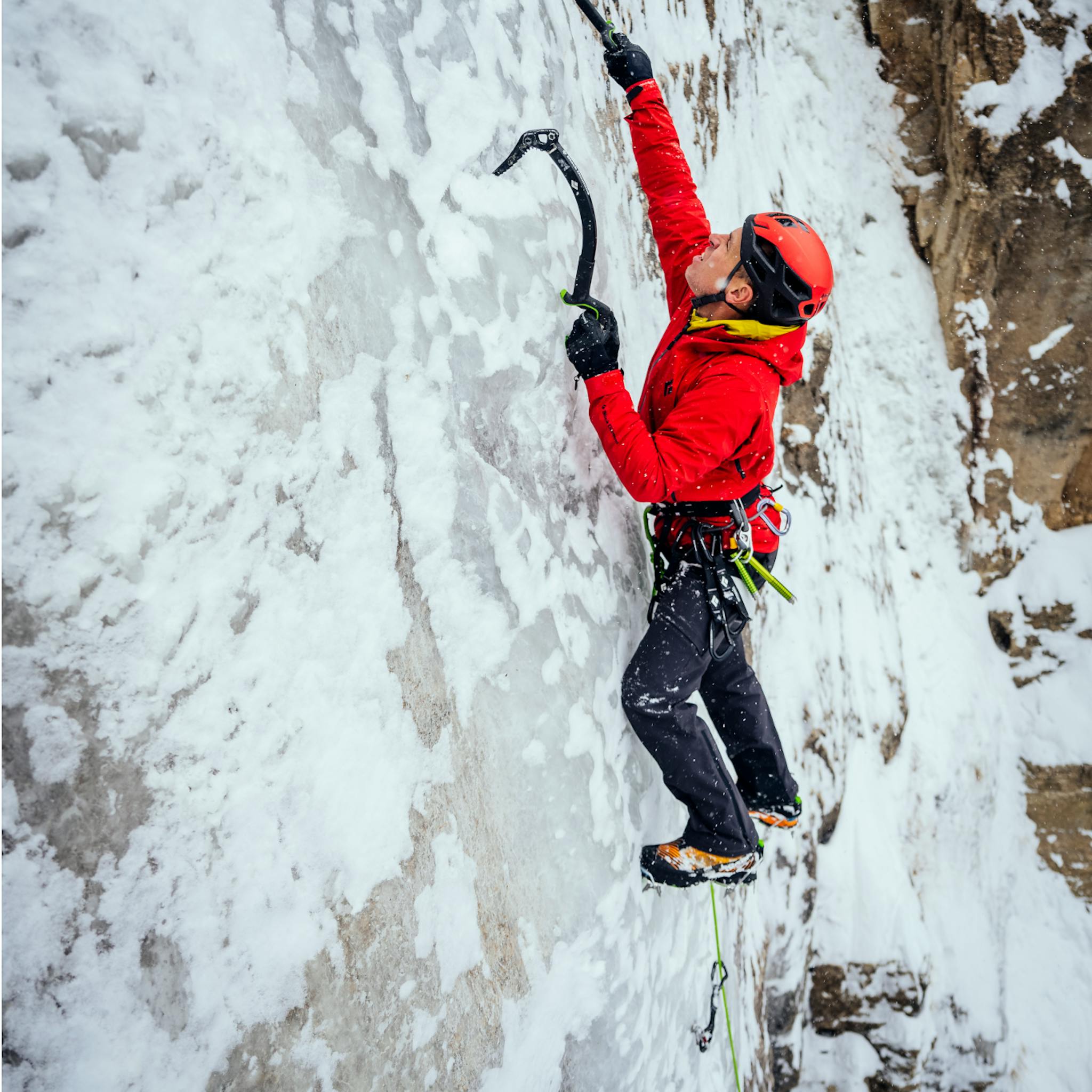 An ice climber wearing the Dawn Patrol Pants.