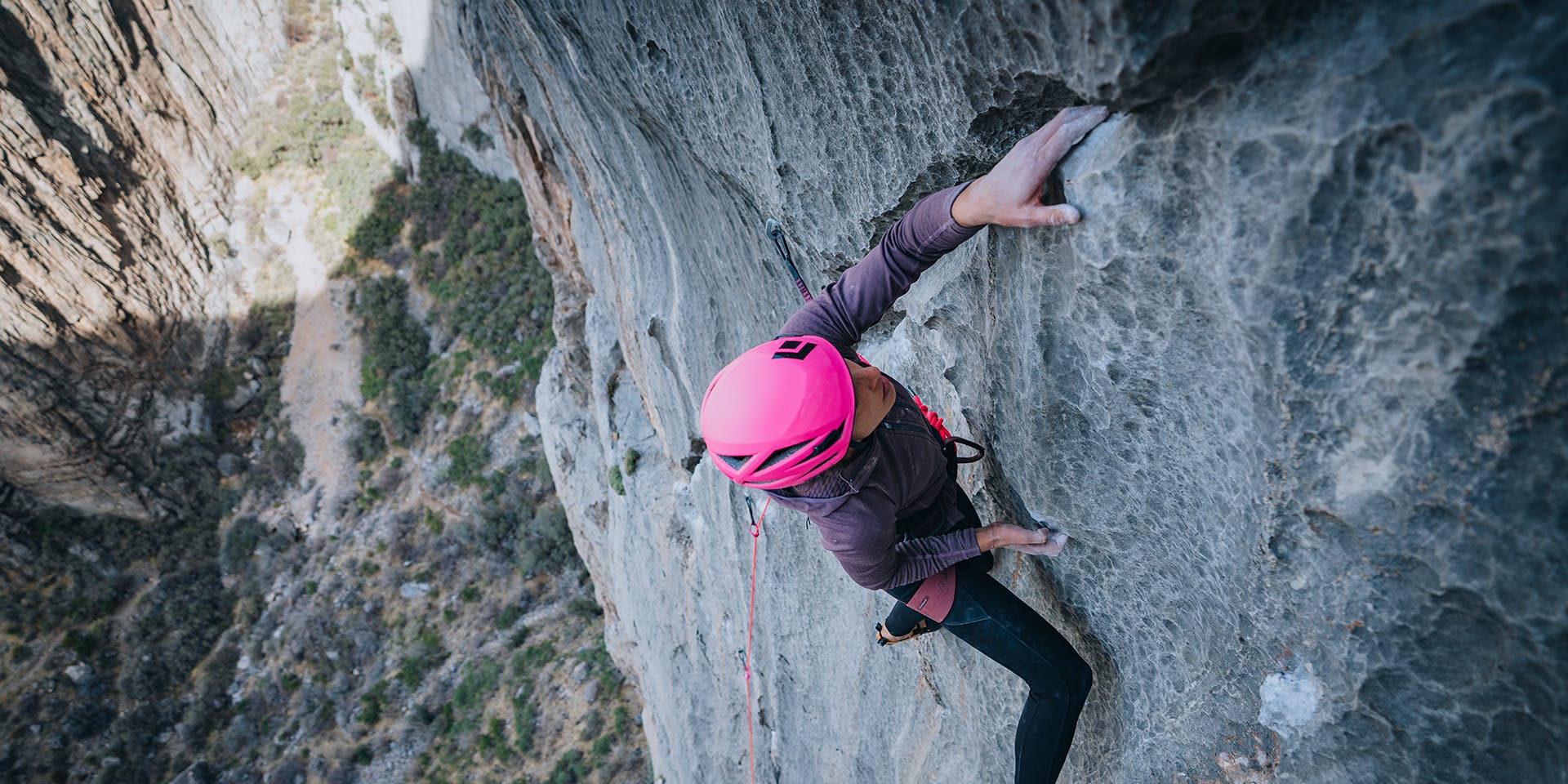 A woman climbing at the grail in Arizona