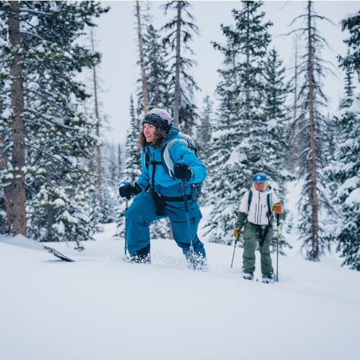 Two skiers skinning in the backcountry. 