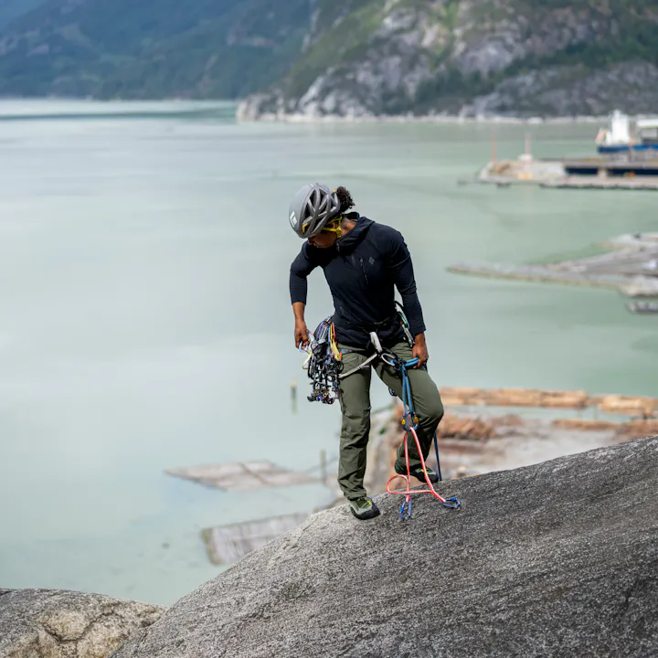 A climber gets ready to rappel a route. 