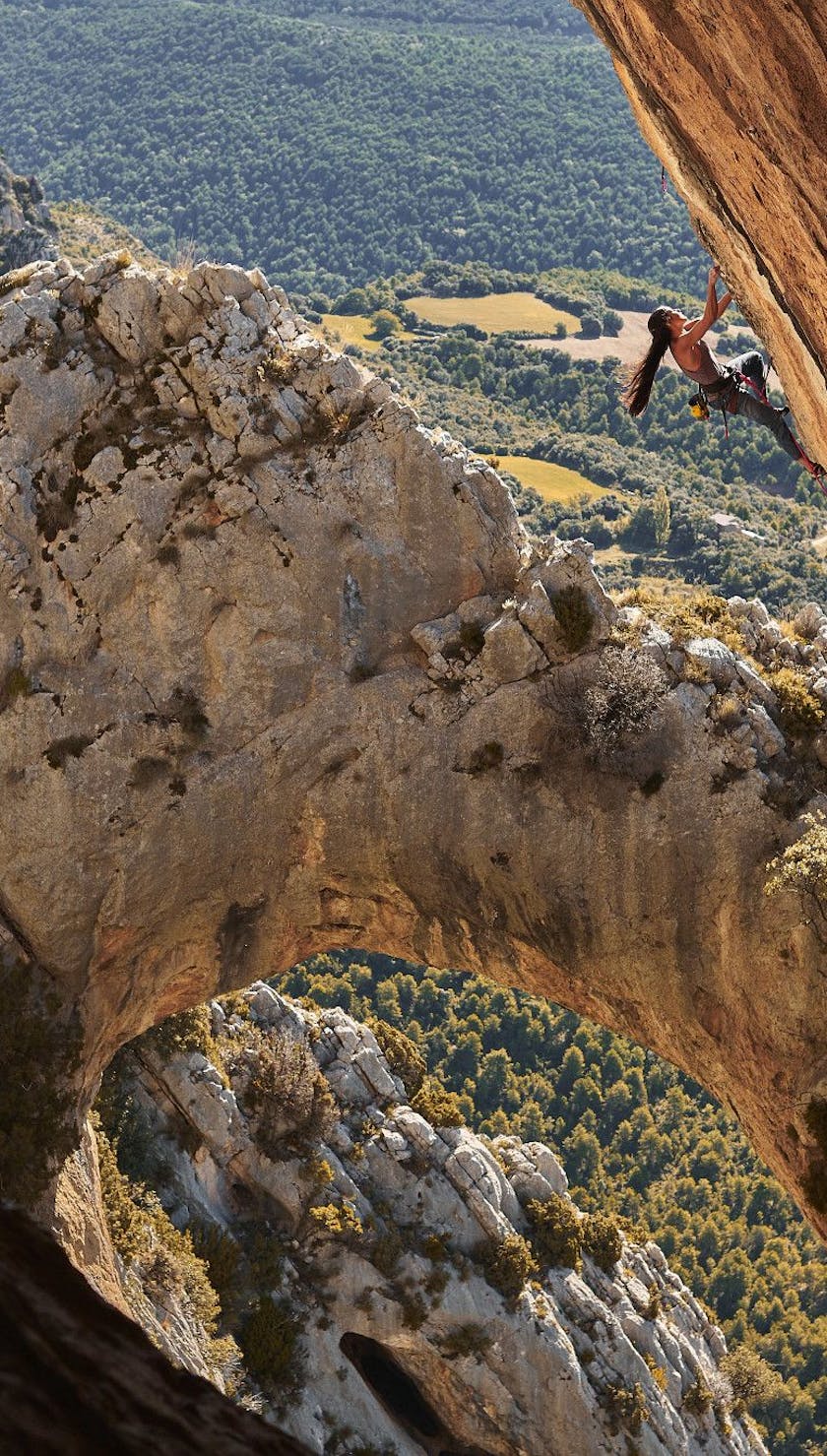 Woman climbing in Rodellar, Spain 
