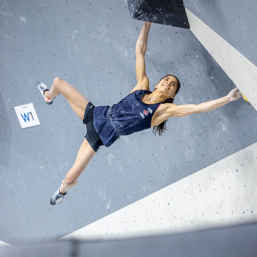 Black Diamond Athlete Natalia Grossman bouldering in a gym.