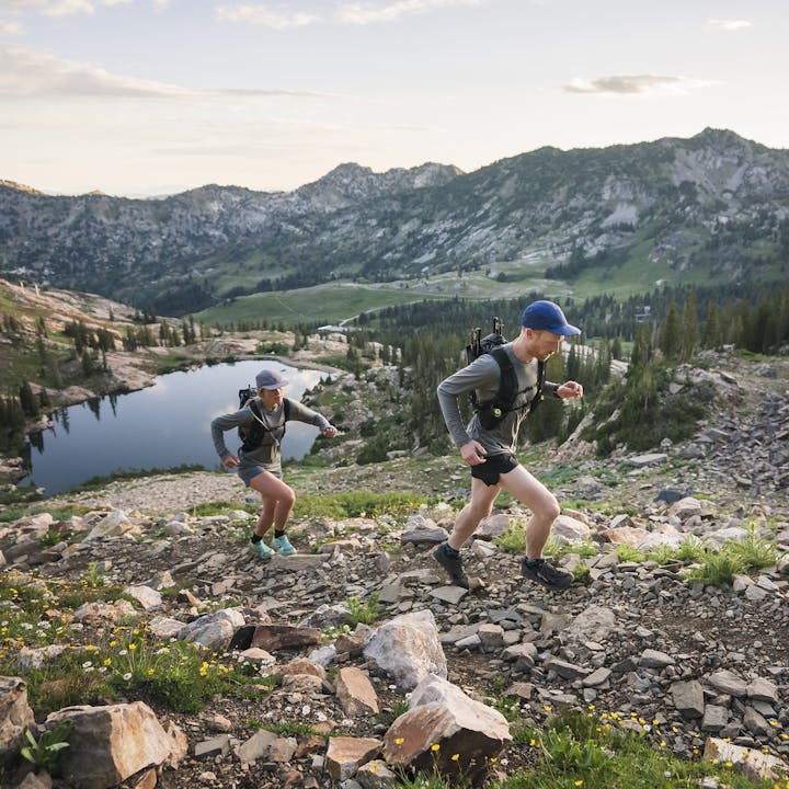 A man and Mary McIntyre trail running in the mountains | Mens Shorts | Climbing Shorts