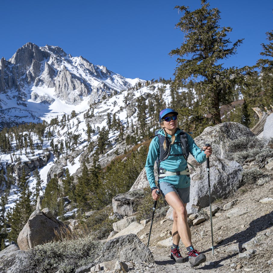 A hiker wearing the Women's Sierra Shorts.