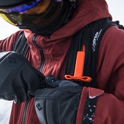 skier clipping into his Jetforce pack