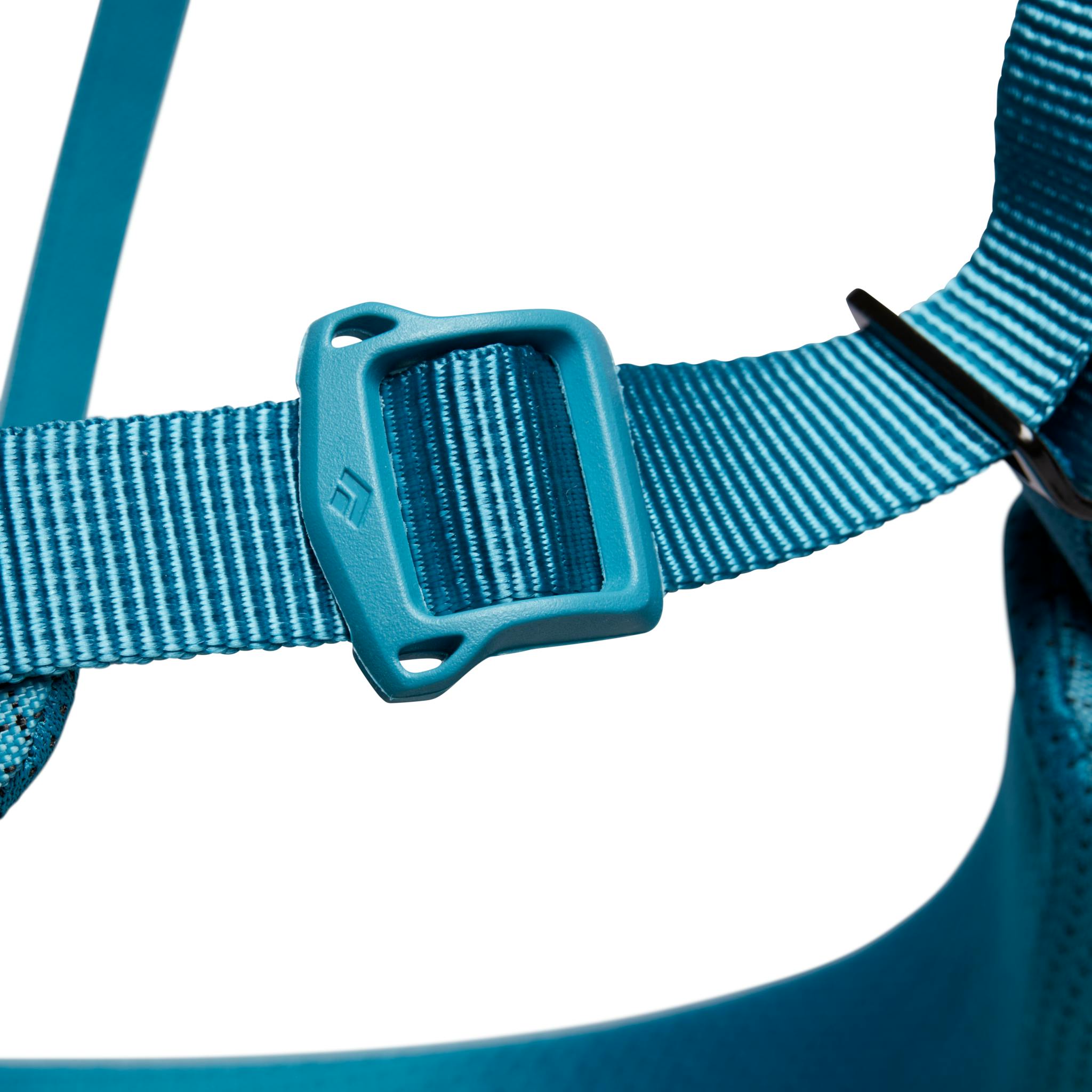 A close up image of the TrakFit leg loops on a blue Women's Momentum Harness