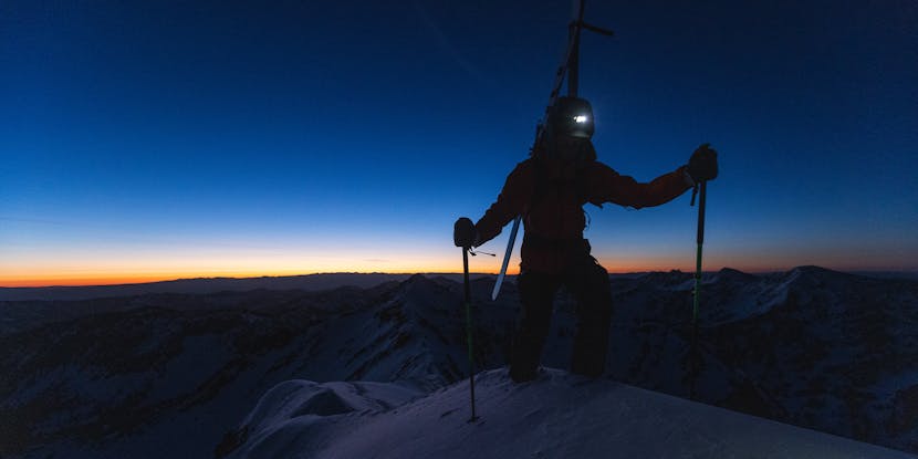 A backcountry Skier uses a Black Dimond headlamp to get to the summit of the mountain. 