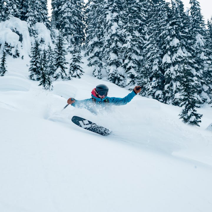 A backcountry skier rips through some powder with the Black Dimond Impulse Skis.  