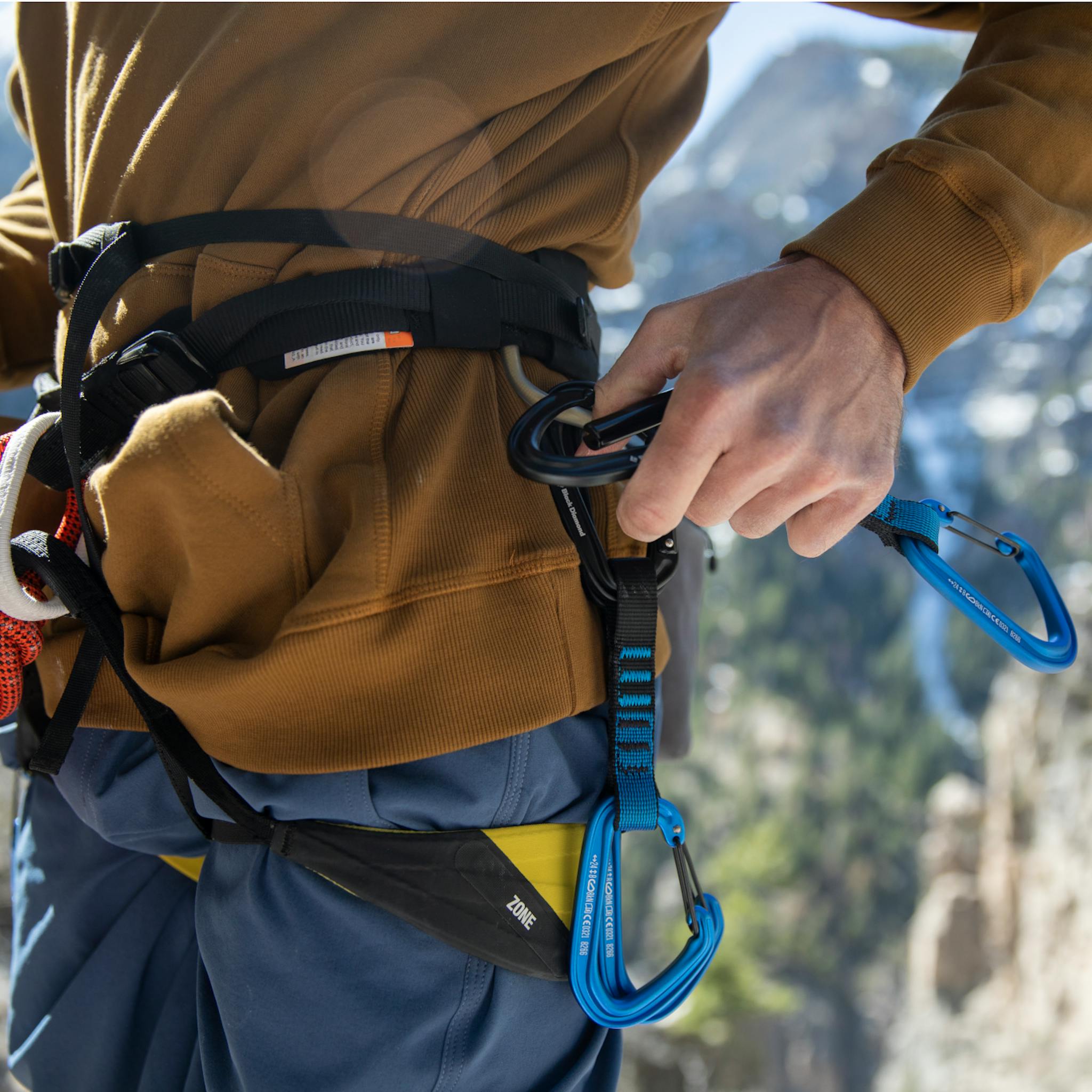 A climber racks up his Hotforge Hybrid Quickdraws.