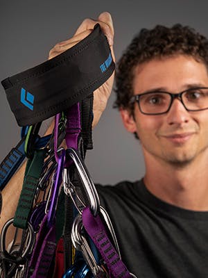 Photograph by Andy Earl of Tyler Willcutt holding his prototype gear sling.