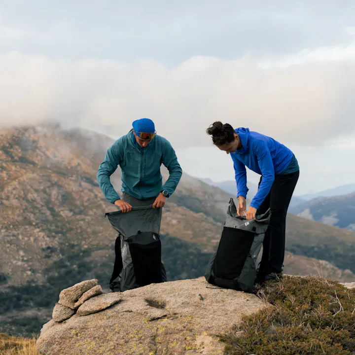 Two backcountry trekkers using the Betalight backpack. 