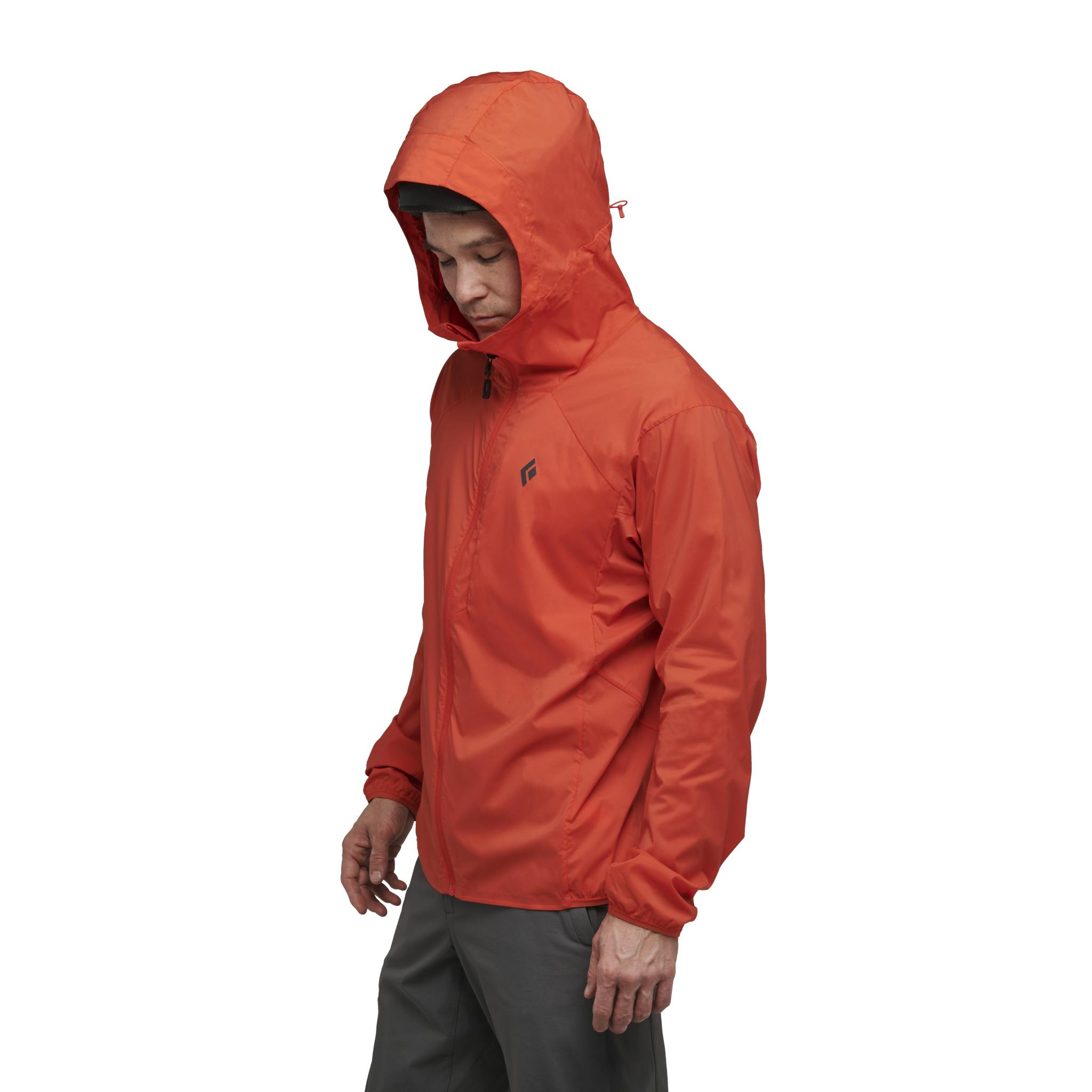 A model in the Alpine Start Hoody with the hood up.