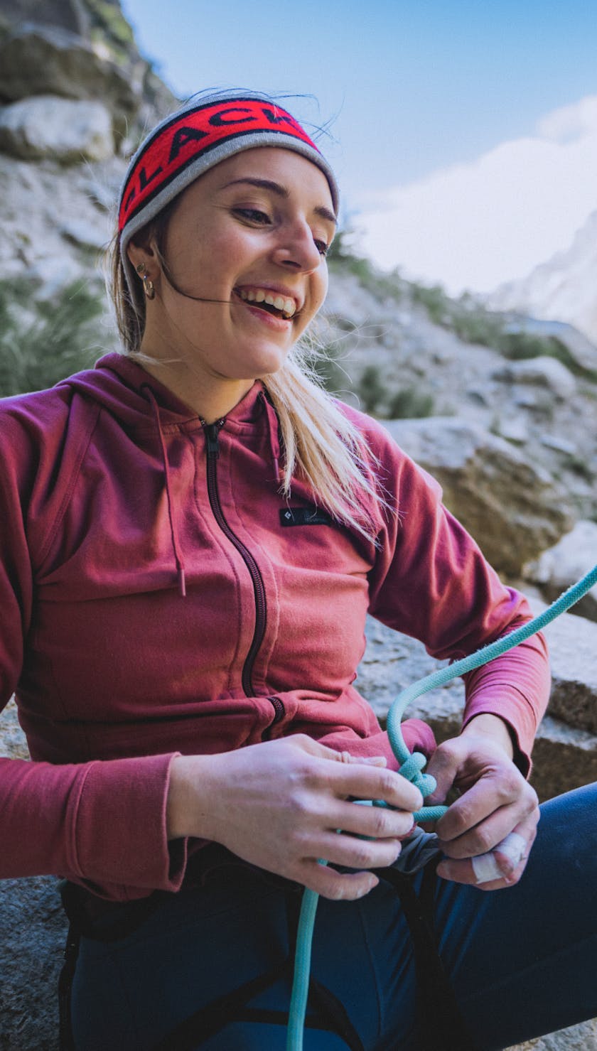 A climber unties their Double Bowline climbing knot.