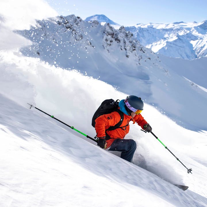 A skier rips down a slope on Black Diamond skis. 