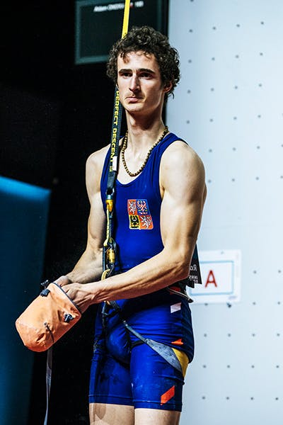 Adam Ondra preparing to compete on the speed wall