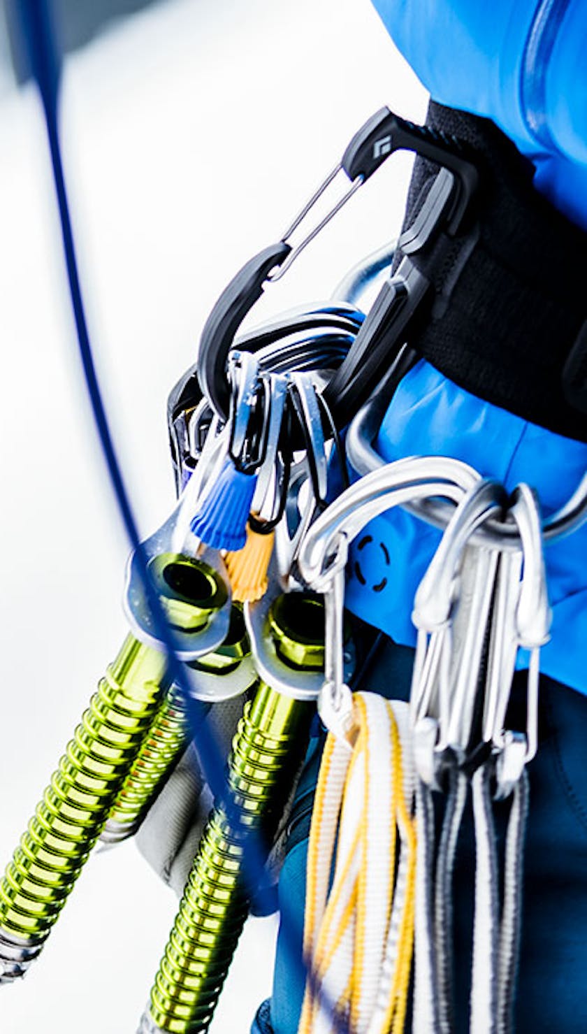 ice climbing gear hanging from harness