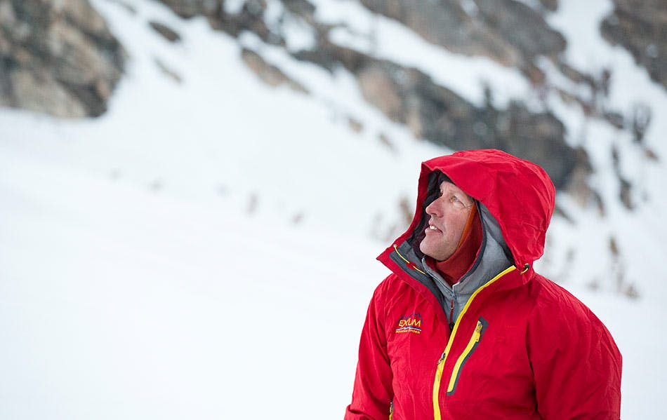 Exum Guide looking at snow conditions