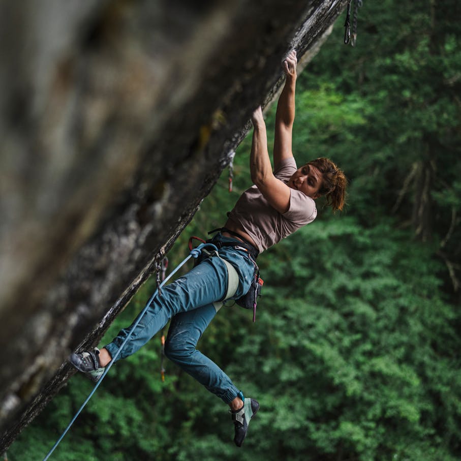 A climber wearing the Women's Notion Pants.