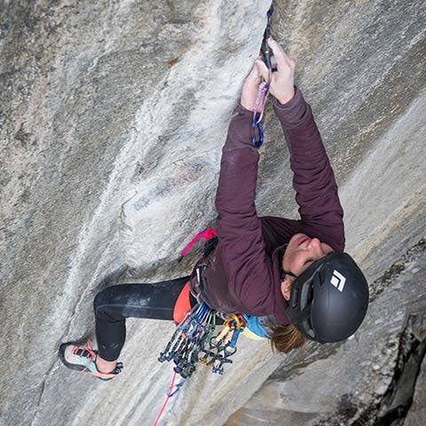 woman climbing a crack