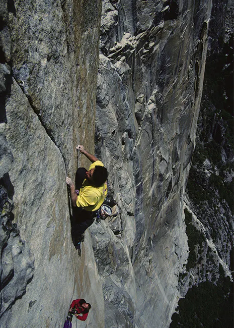 man climbing Yosemite valley.