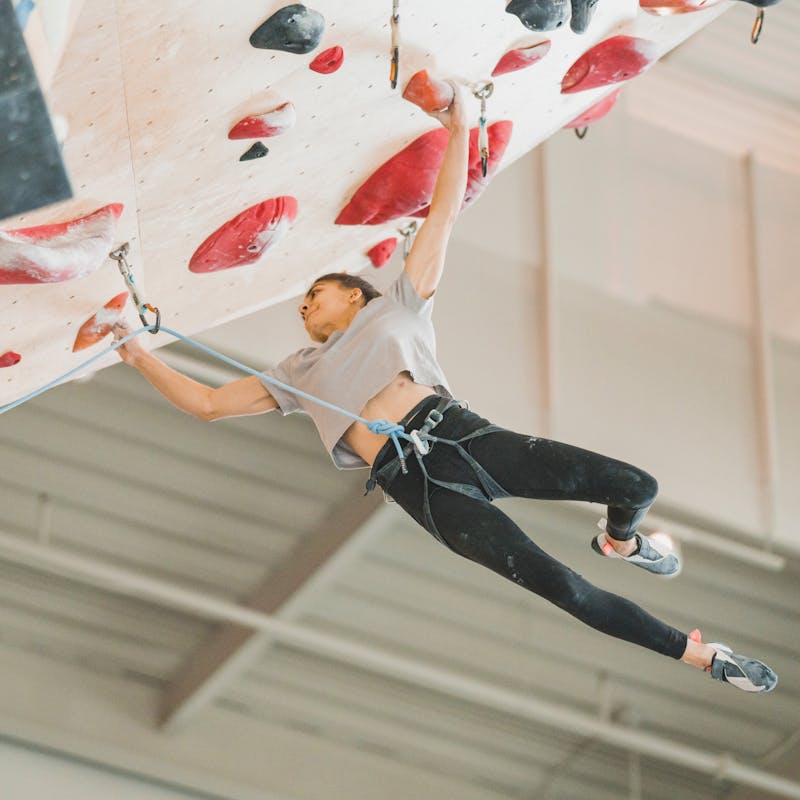 Natalia Grossman climbing in the Airnet Harness.