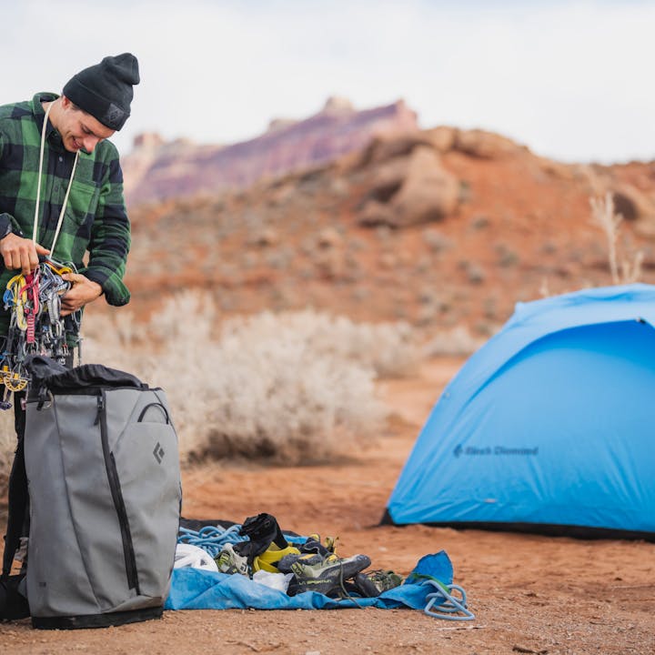 Connor Herson in a Project Flannel preps for a day of climbing in the desert. 