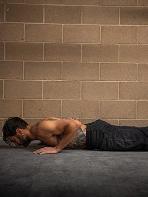 Profile photo of Sam Elias in lower pushup motion.