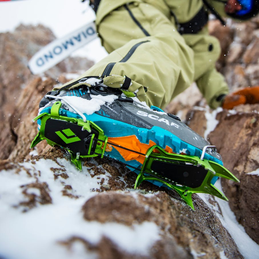 A backcountry skier using the Neve Crampon.