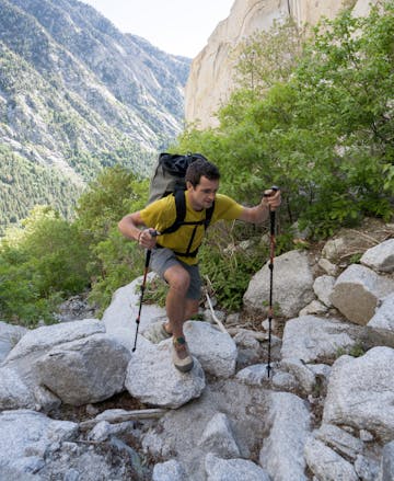 Black Diamond employee approaching the crag with the Alpine Carbon Cork Trekking poles. 